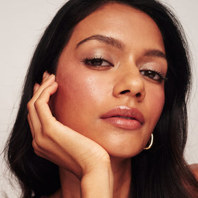 Eye Perfecting Shimmer Stick in Pearl applied to model's lids for a luminous, light-reflecting glow.