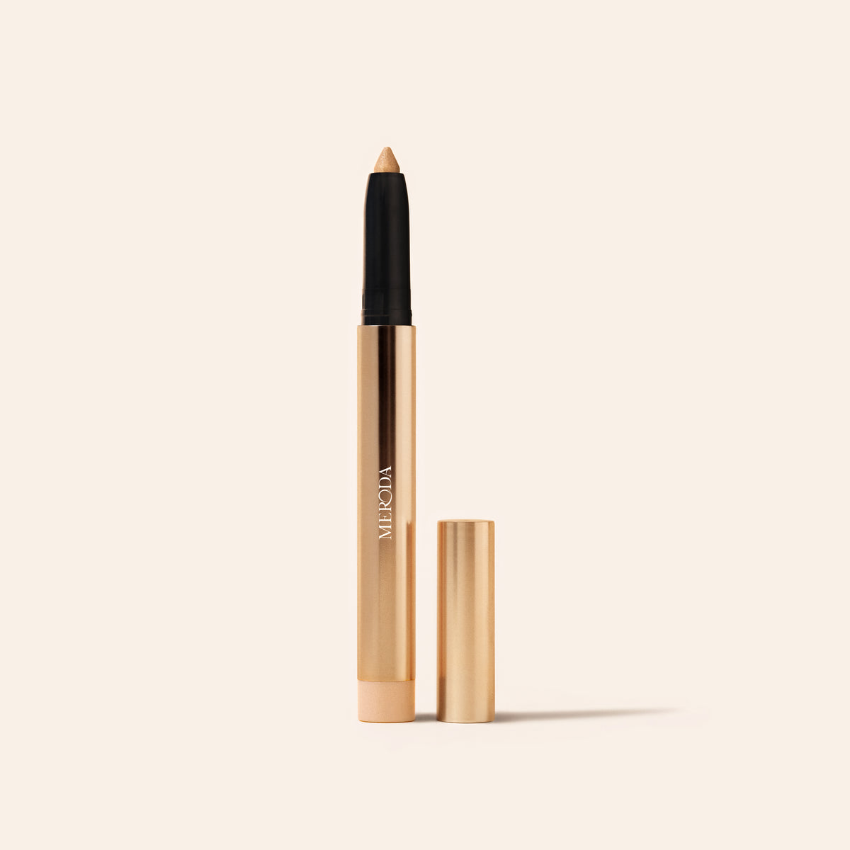 Eye Perfecting Shimmer Stick in Champagne featuring a luminous finish and a gold metallic casing.