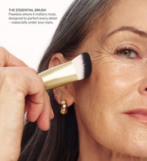 The Essential Brush application on model blending makeup for a seamless and flawless finish under the eyes