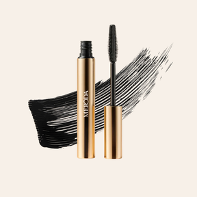 Gilded Lashes Mascara tube, wand and black texture swatch showcasing the lengthening and volumising formula