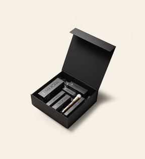 Meroda Cosmetics matte black Gift Box open with various makeup products inside