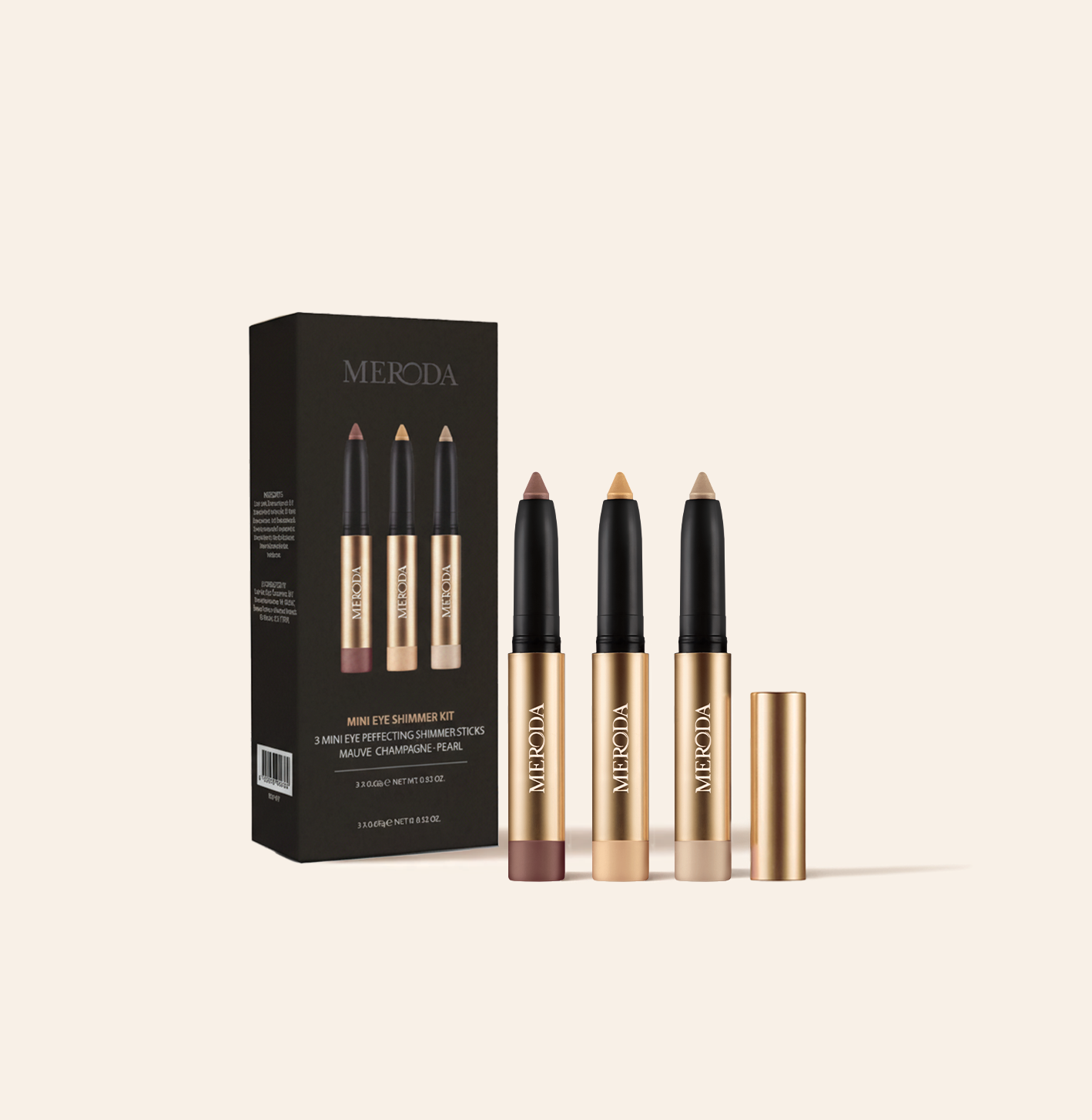 Mini Eye Shimmer Set featuring three gold sticks in Mauve, Champagne and Pearl beside their black branded box.