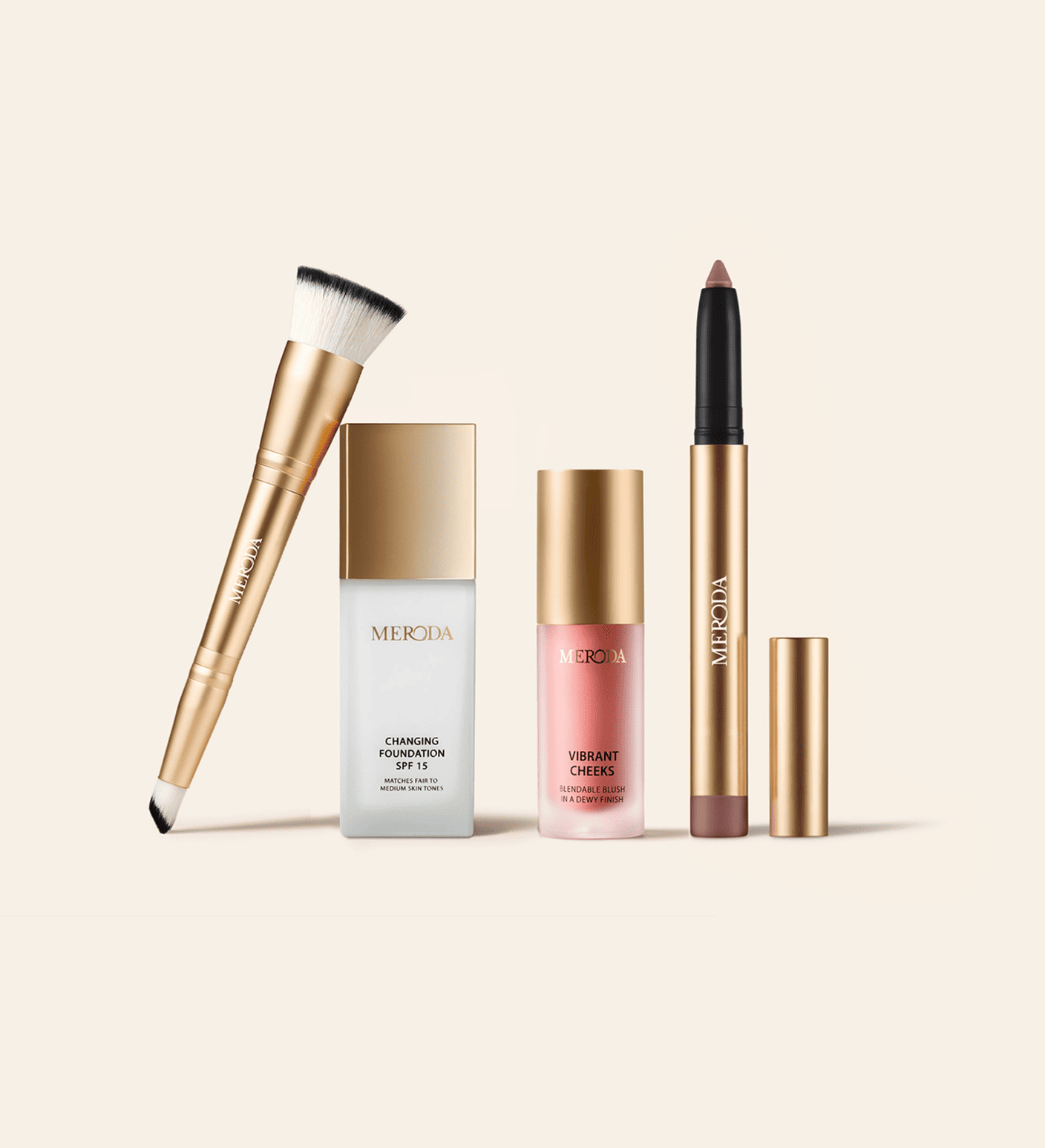 The Daily Routine Set featuring 2-in-1 Build & Conceal Brush, Changing Foundation SPF 15, Vibrant Cheeks Liquid Blush and Eye Perfecting Shimmer Stick on a light background