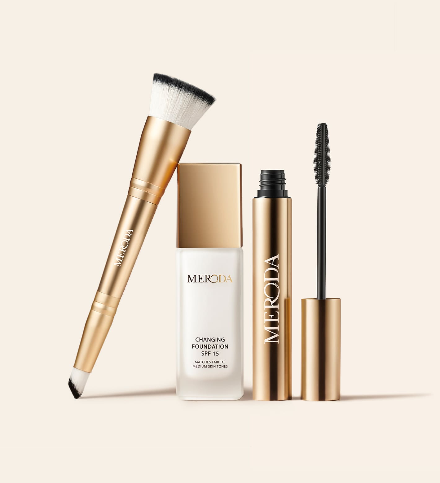 The Meroda Starter Set featuring gold Changing Foundation, Gilded Lashes Mascara and 2-in-1 Build & Conceal Brush.