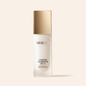 A pump bottle of MERODA Changing Foundation SPF 15, which is buildable and adapts to skin color, concealing redness and imperfections.