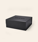 Matte black Gift Box featuring an embossed MERODA logo on the lid on a cream background.