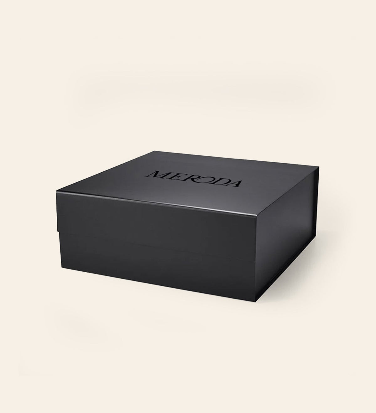 Matte black Gift Box featuring an embossed MERODA logo on the lid on a cream background.