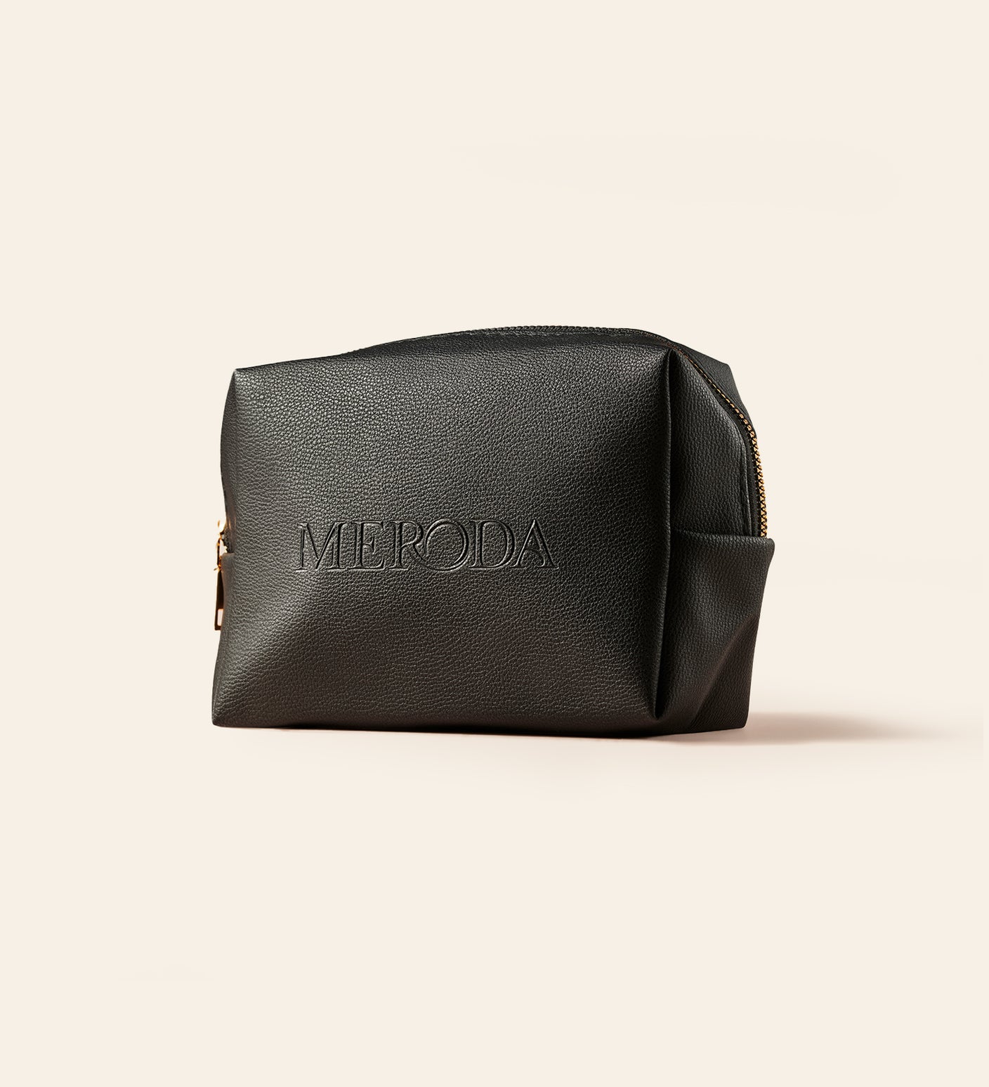 The Travel Bag in black featuring the embossed Meroda logo for keeping beauty essentials organised