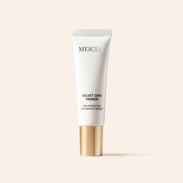 Velvet Skin Primer in a sleek white tube with a gold cap for a smooth, pore-blurring make-up base.