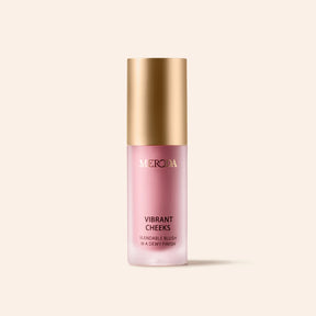 Vibrant Cheeks Liquid Blush in Grape Galore, a dewy purple blush in a frosted bottle with a gold cap.