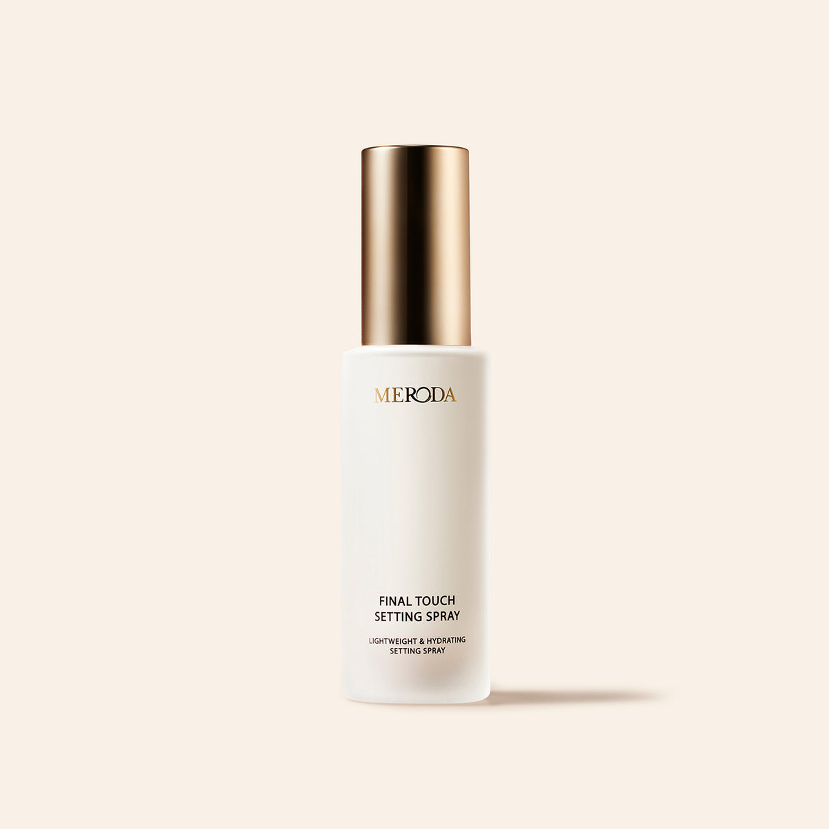 Meroda Mini Final Touch Setting Spray in a white bottle with a gold cap for a lightweight, hydrating finish