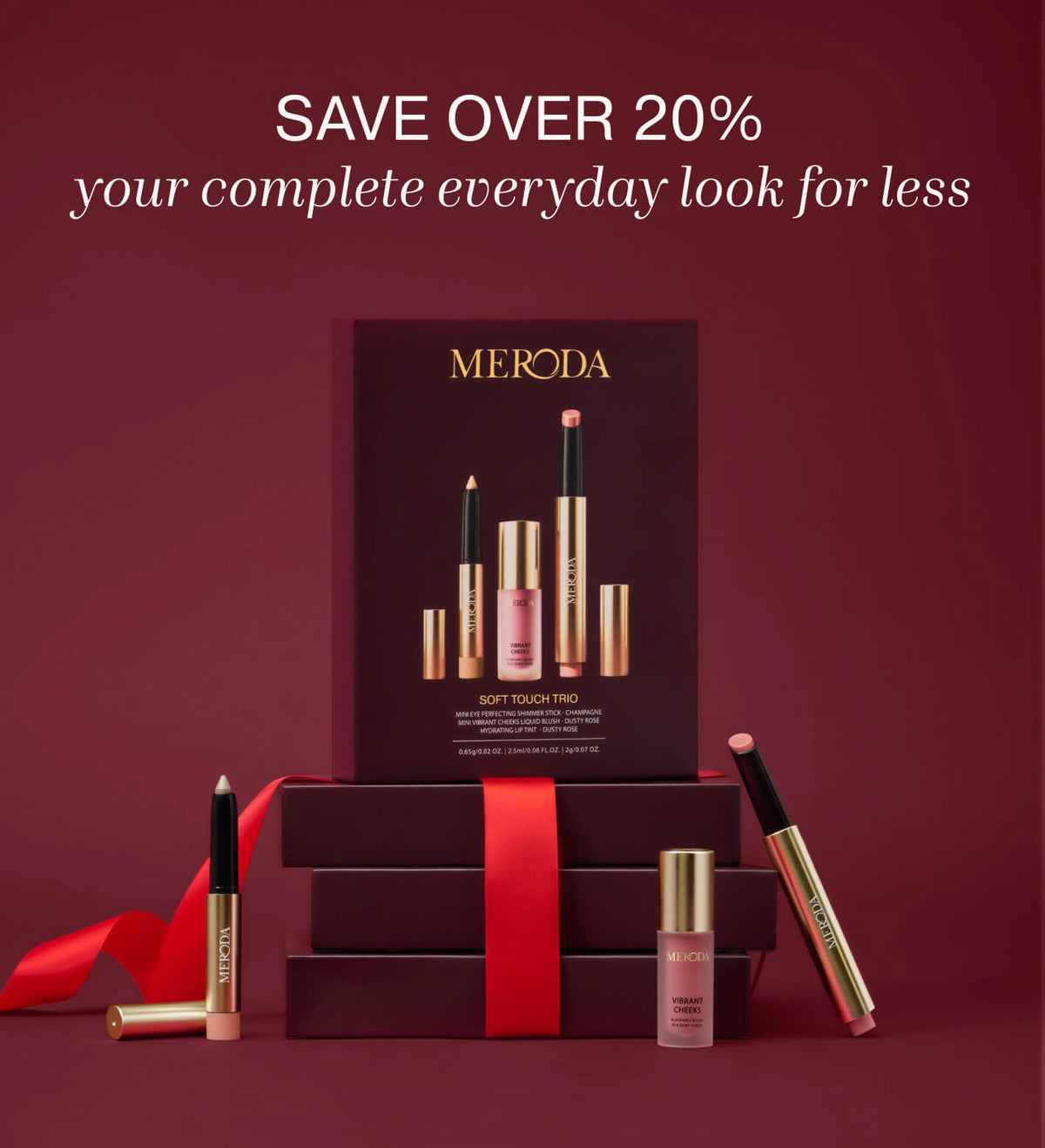 Soft Touch Trio makeup set featuring the eye shimmer stick, liquid blush, and lip tint displayed with gift boxes and a red ribbon.