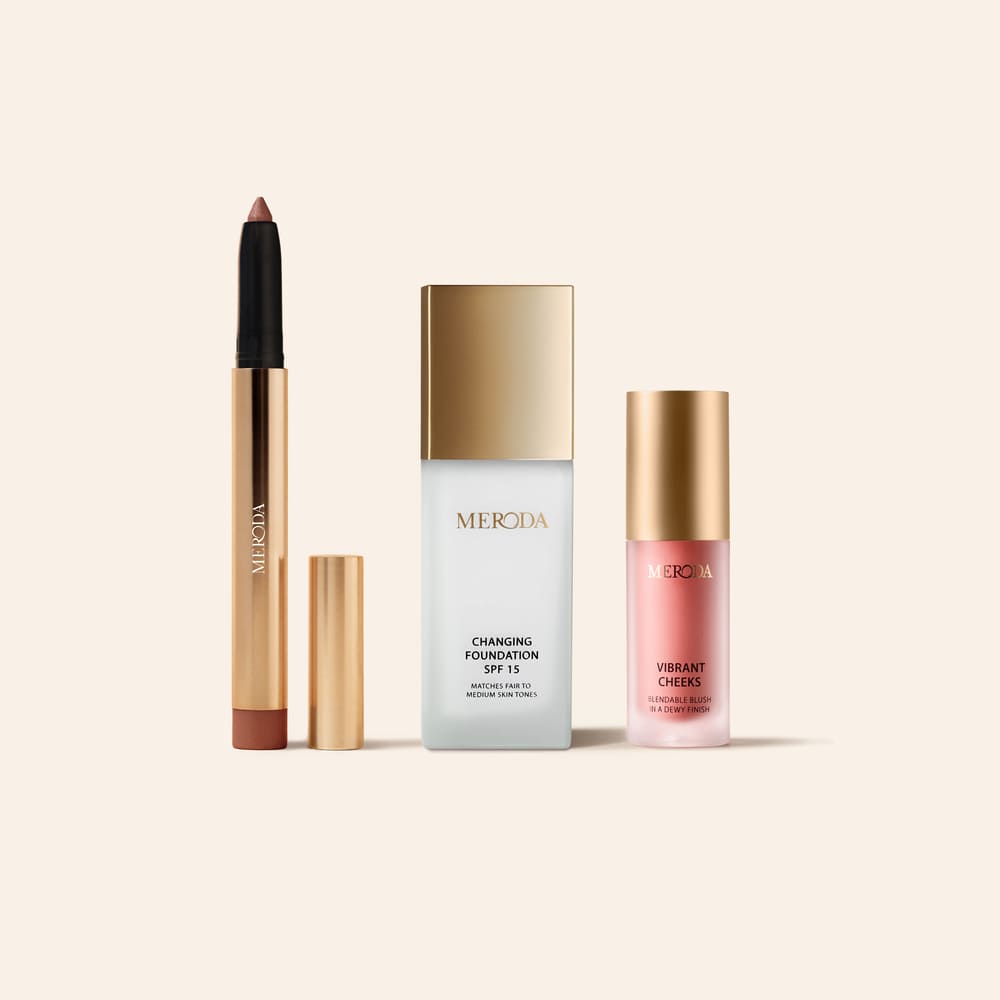 The No-Makeup Makeup Kit featuring Changing Foundation, Eye Perfecting Shimmer Stick and Vibrant Cheeks Liquid Blush on a light background