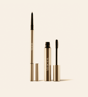 The Brow Defining Duo featuring The Precision Brow Pencil and Gel in sleek gold metallic casing