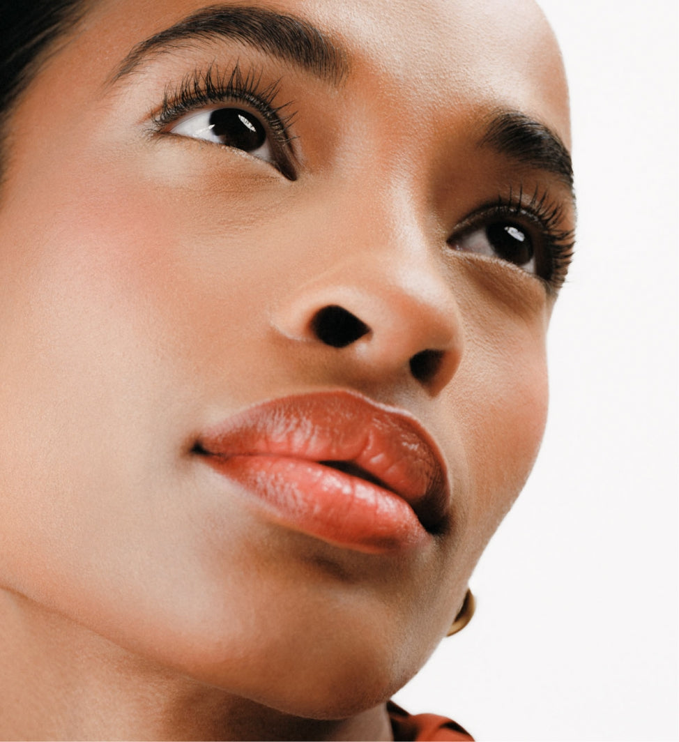 The Key Essentials look on model featuring Changing Foundation for even skin and lengthened Gilded Lashes Mascara.