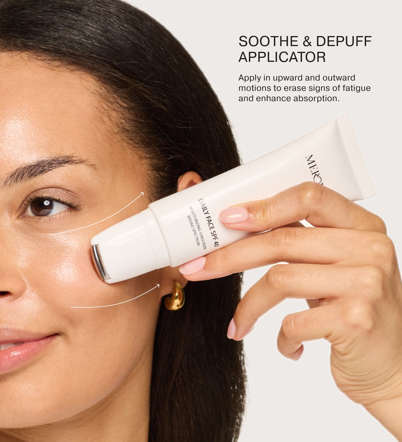 Daily Face SPF 40 cooling metal rollerball applicator used in upward motions to soothe and depuff the complexion.