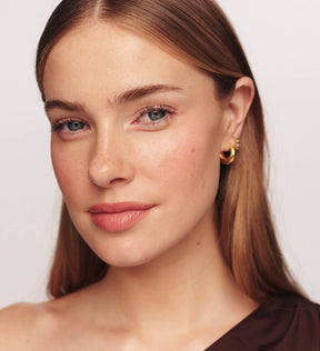 Blush Discovery Trio on a model creating a soft, healthy glow with a natural and vibrant liquid blush finish.