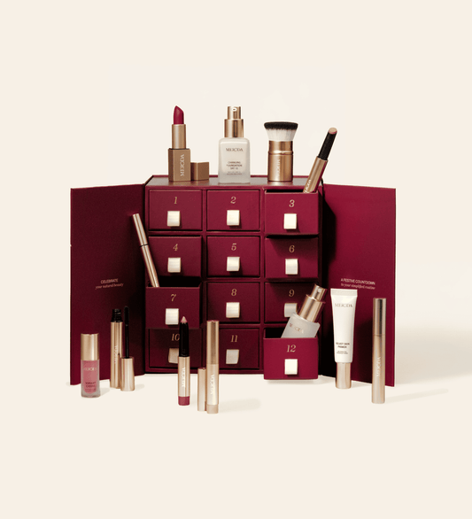 Advent Calendar featuring 12 numbered drawers surrounded by various Meroda beauty products.
